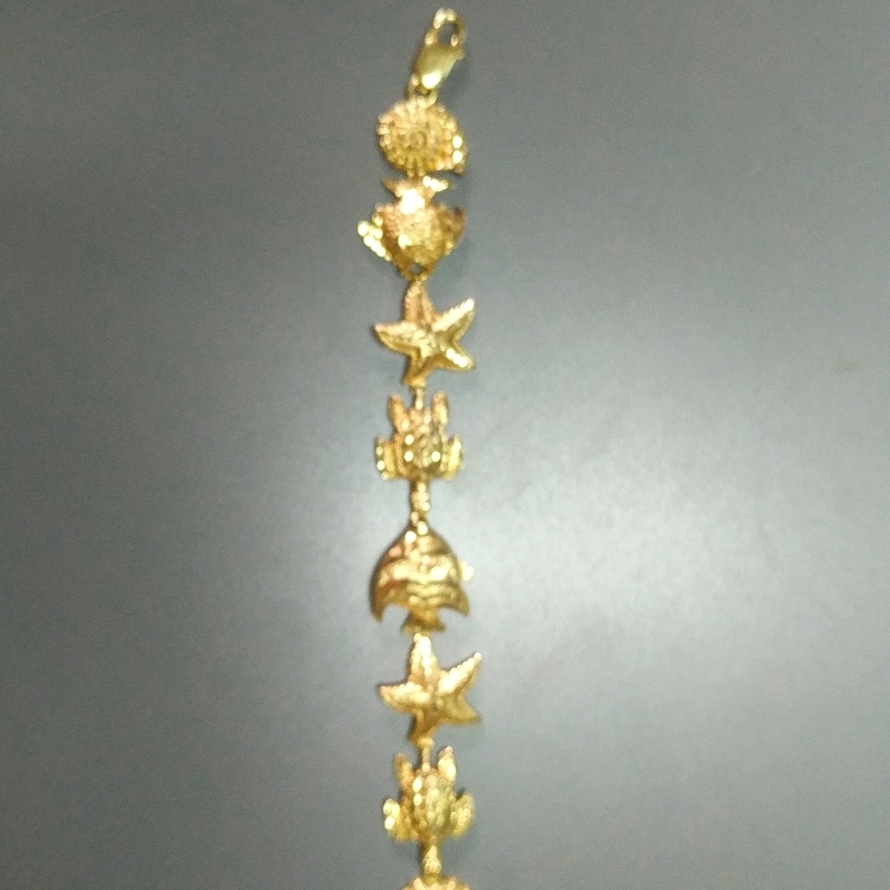 14 kt yellow gold sea life bracelet